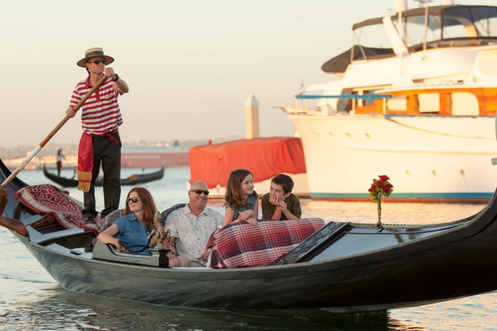 a group of people on a boat in the water