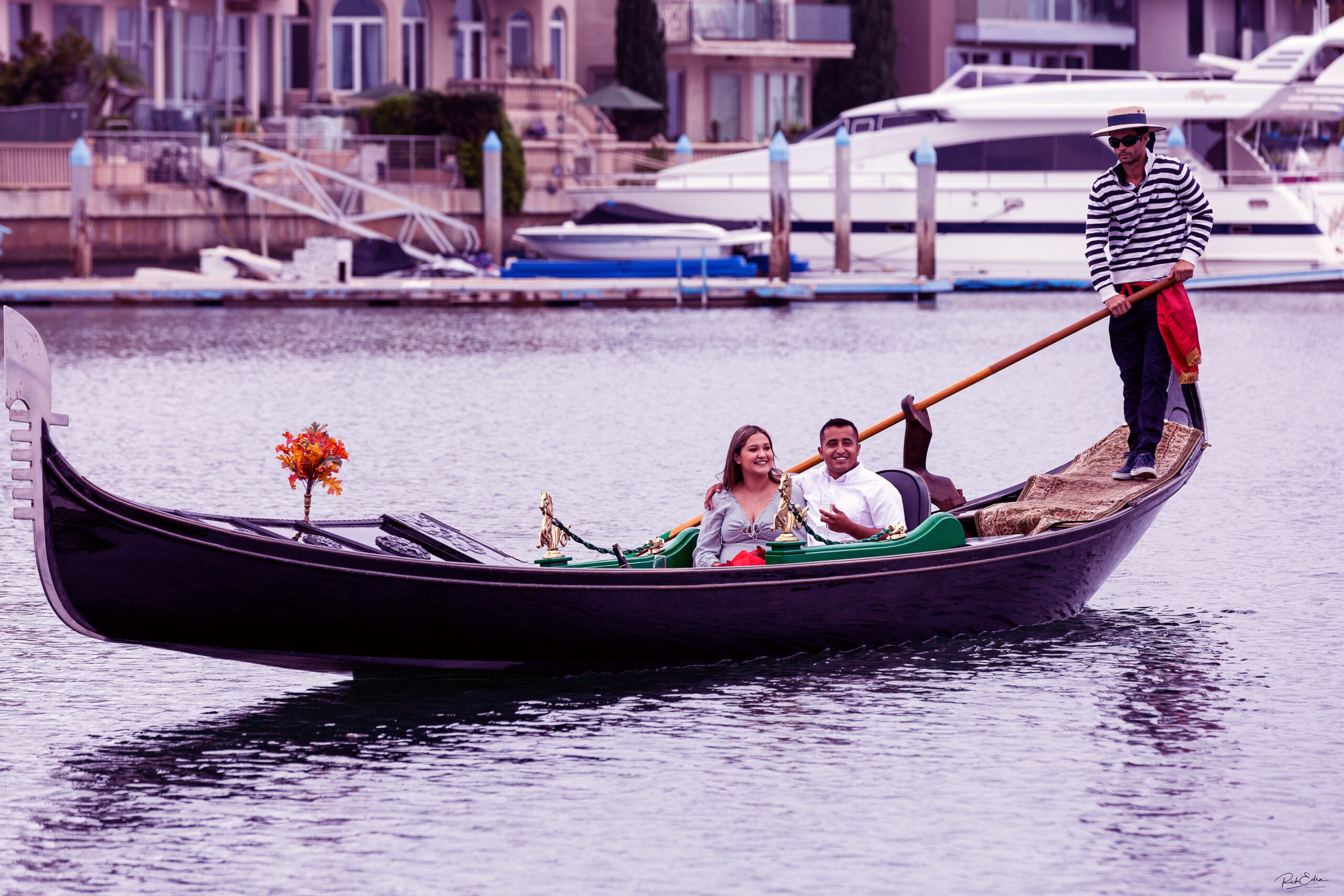 A couple celebrating a romantic ride at The Gondola Company in San Diego Bay in Coronado