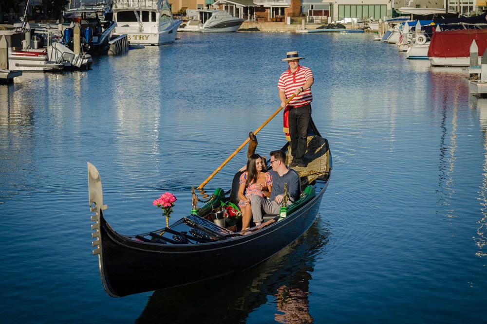 a gondola in a harbor next to a body of water