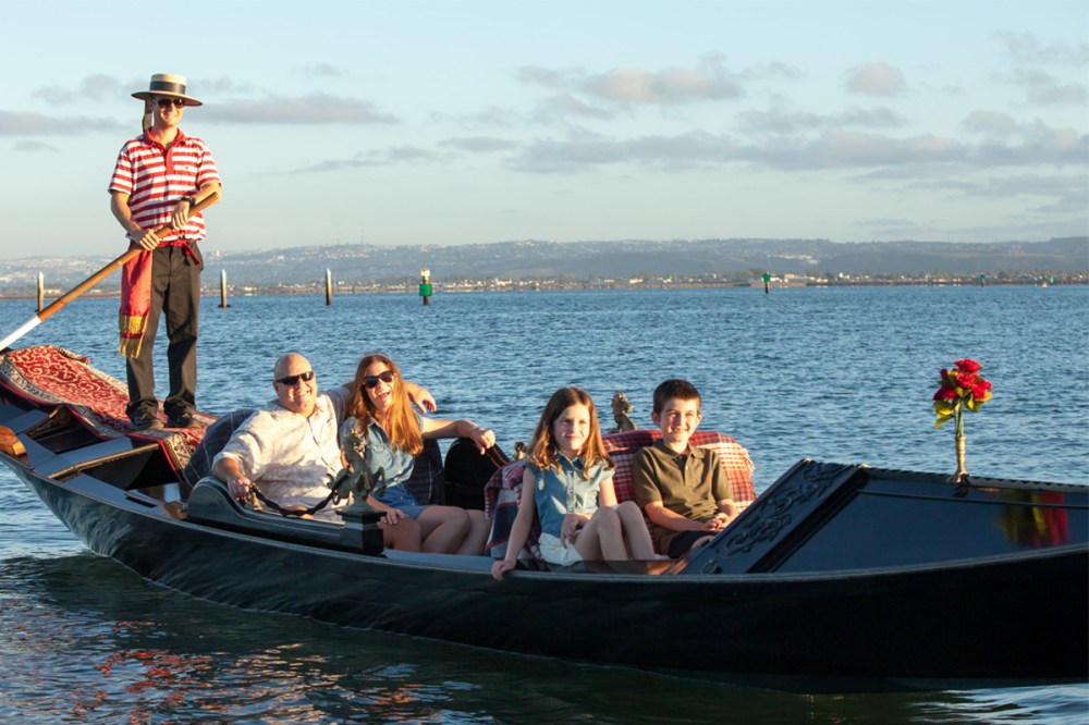 A family celebrating on a gondola in San Diego bay